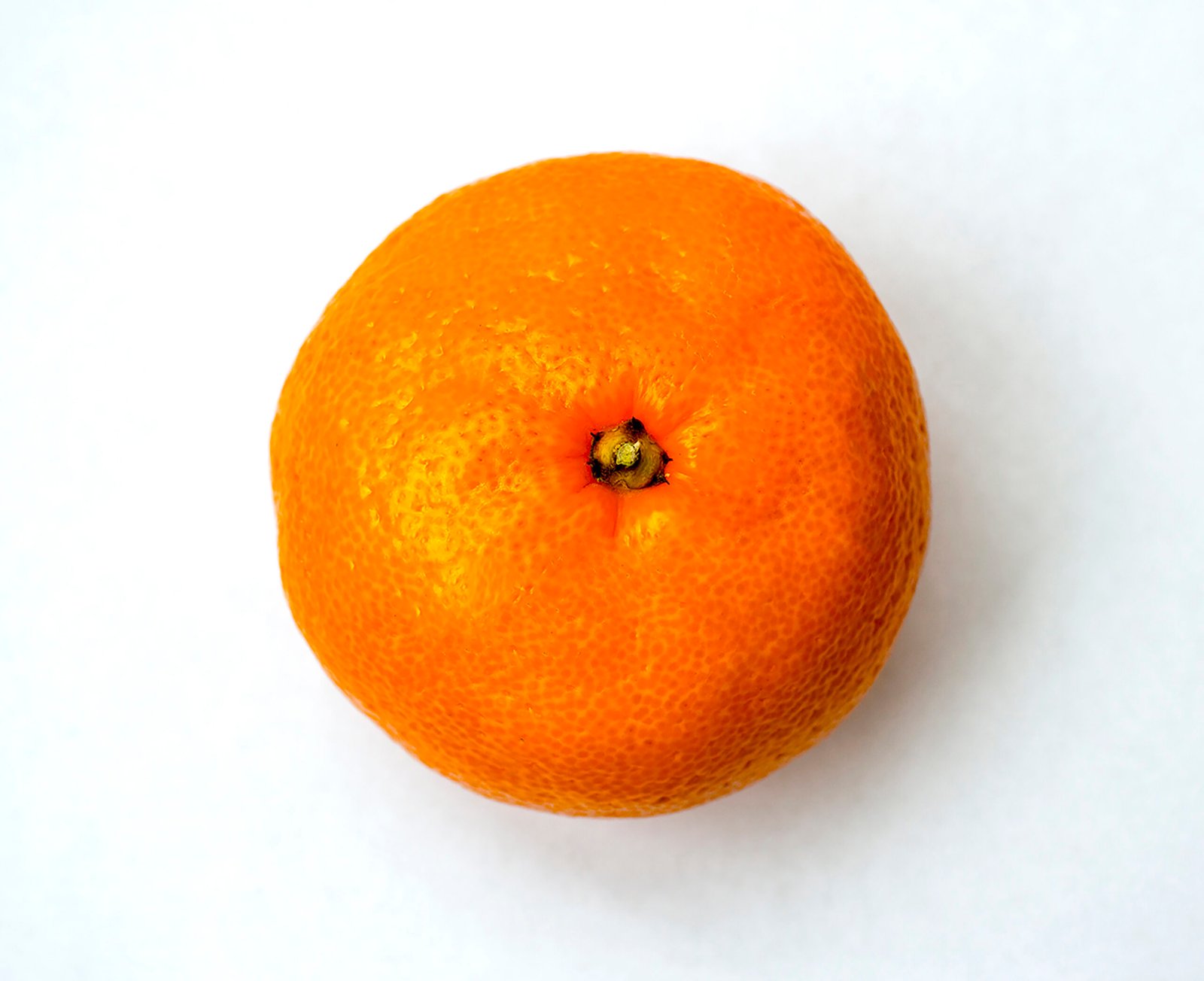 99387608 Closeup photo of tangerine fruit isolated on white background Tangerine fruits on a light backgrou